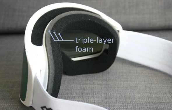 A pair of ski goggles with triple-layer foam.