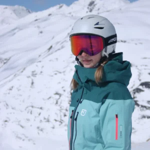 A female wearing an Infinity 2 Black - Phoenix Red goggles - Front side view