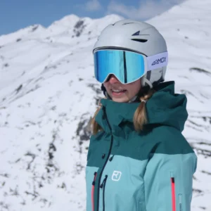 A female wearing an Infinity 2 White - Ice Blue goggles - Front side view